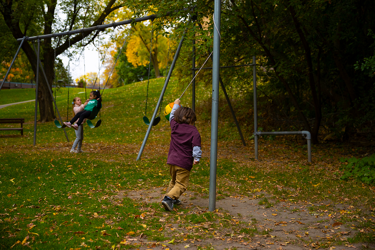 Children Playing on Swings at Apartment Rentals in Inver Grove Heights, MN