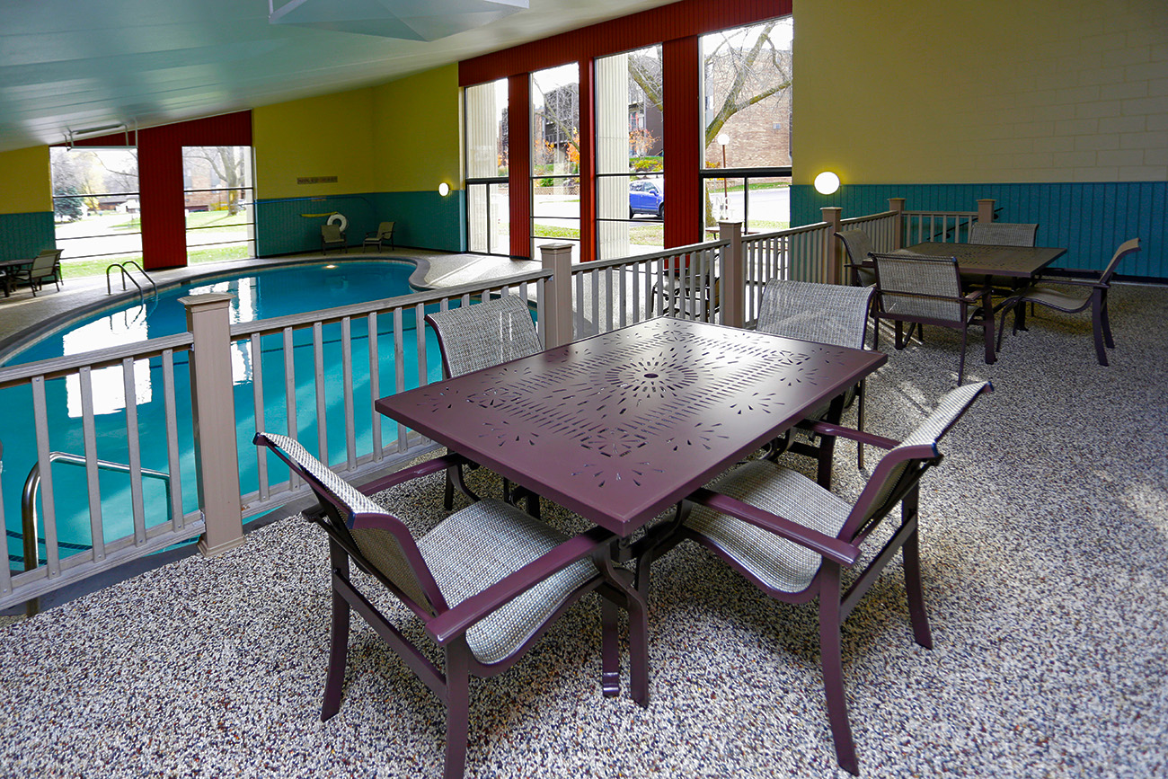 Indoor pool with deck area at Salem Green apartments in Inver Grove Heights