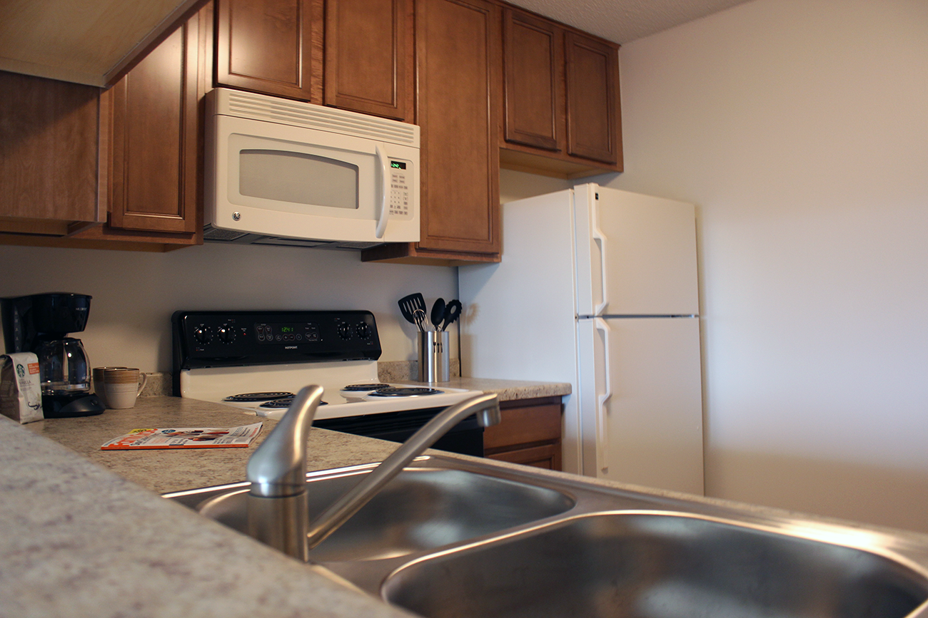 Kitchen with microwave in apartments in Inver Grove Heights, MN