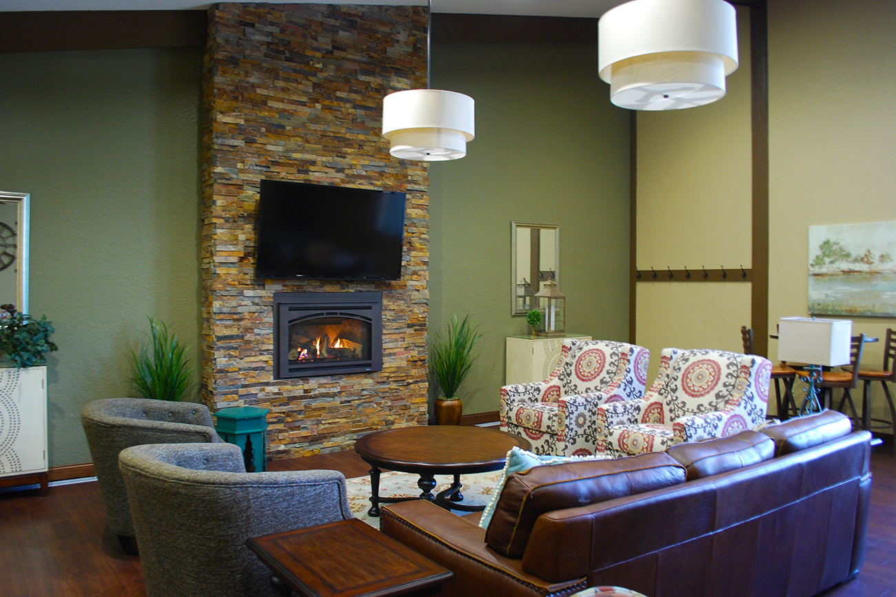 Party room in the Clubhouse with fireplace at apartments in Inver Grove Heights, MN