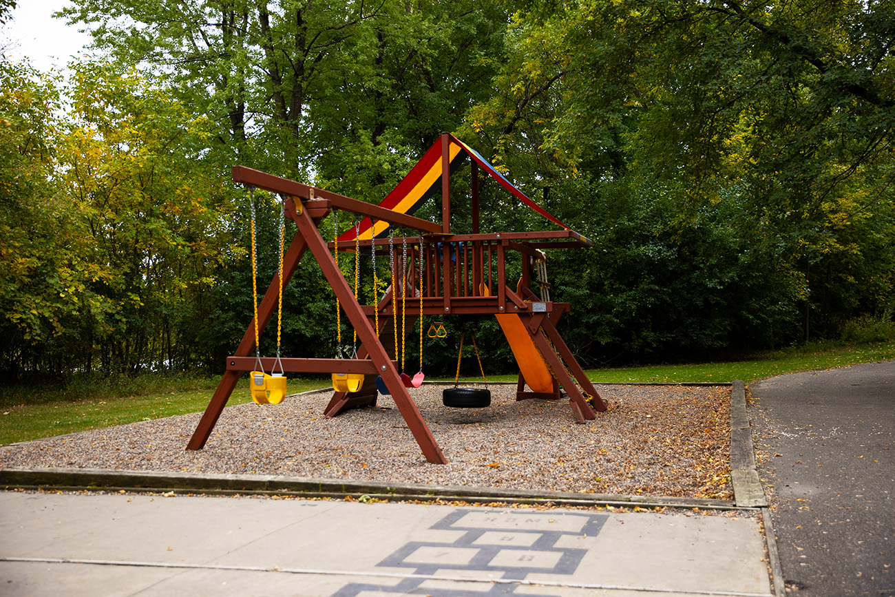 Playground with Swings and Slide at Apartments in Inver Grove Heights, MN